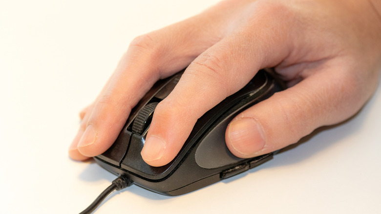 Hand using computer mouse
