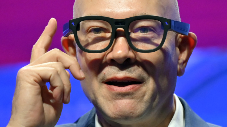 A man using a pair of smart glasses.