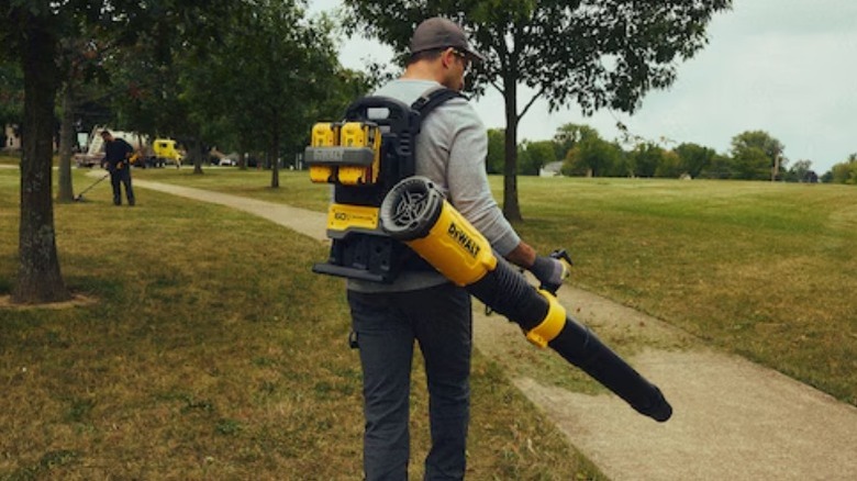 Person using new backpack blower