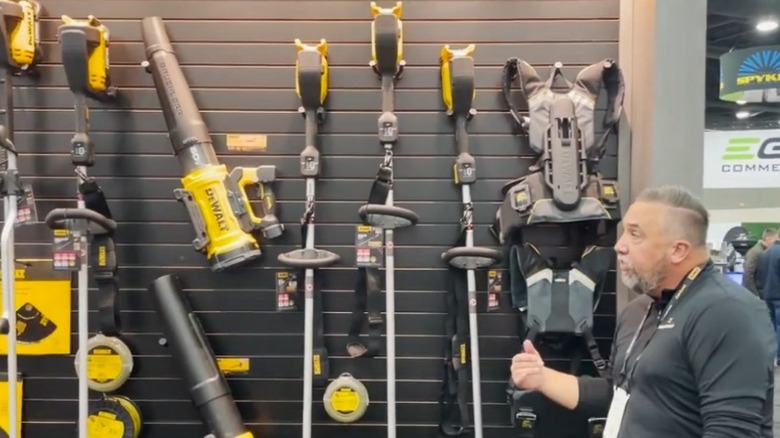 Aaron Griffith showcasing new DeWalt landscaping stick tools