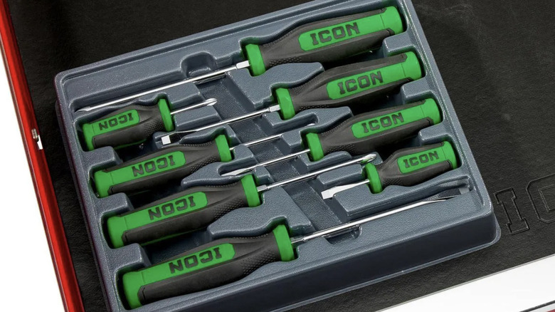A set of green Icon screwdrivers in a black case