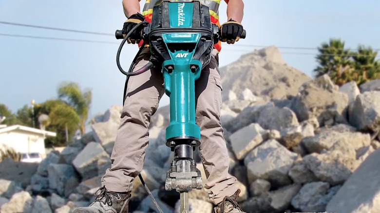 Person using Makita Breaker Hammer