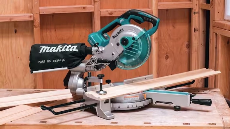 Person using Makita Compound Miter Saw