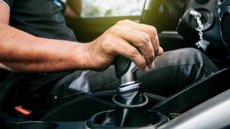 Man grabbing gear shifter