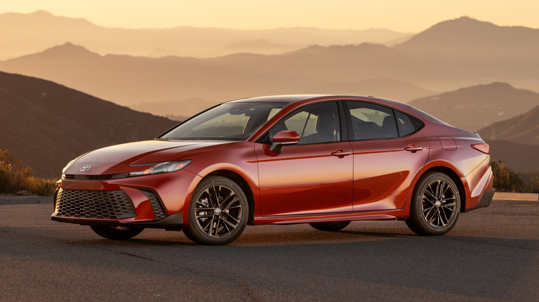 2026 Toyota Camry SE AWD model in Supersonic Red