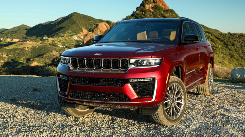 2026 Jeep Grand Cherokee parked on gravel near hills