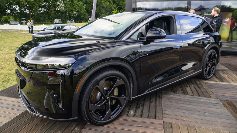 A black Lucid Gravity Grand Touring parked on display.