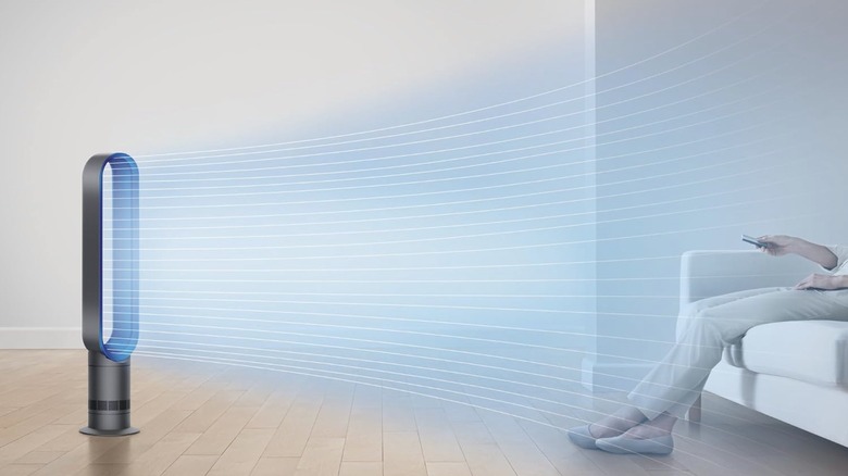 Dyson tower fan cooling a living room