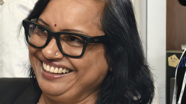 Person wearing Meta Ray-Ban glasses.