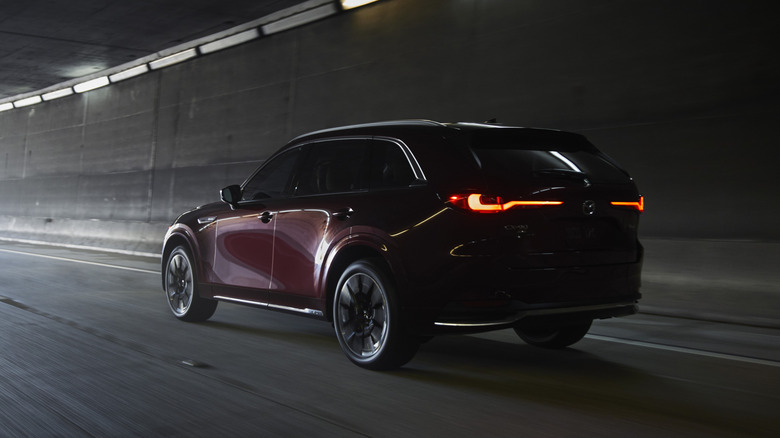Mazda CX-90 rear 3/4 view dynamic image in a tunnel