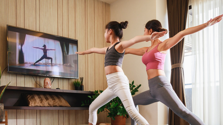 people copying workout on tv