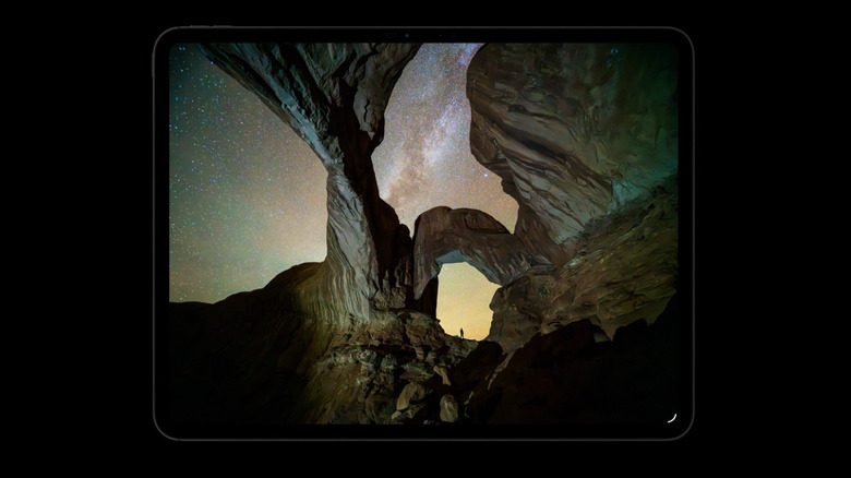 The iPad Pro M5 displaying a dark starry night scene on its tandem OLED screen