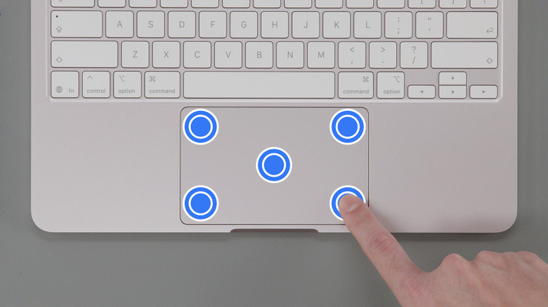Top-down view of a person using the MacBook Neo trackpad