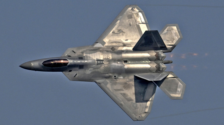 An F22 Raptor in a knife edge turn