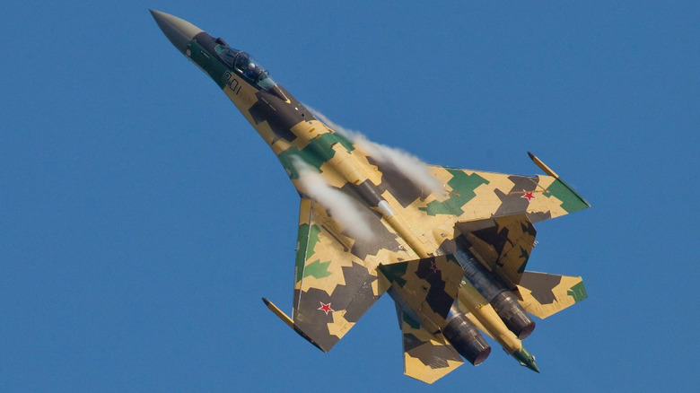 A Sukhoi Su-35 performing a vertical pitch maneeuver.