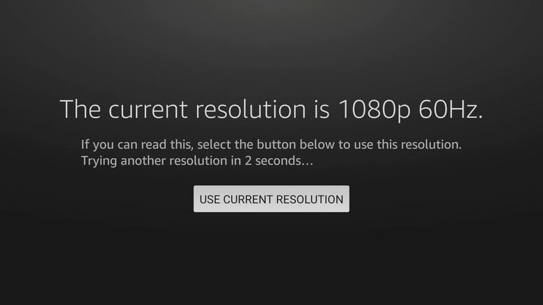 A screen with white letters on a black background reading "The current resolution is 1080p 60Hz"