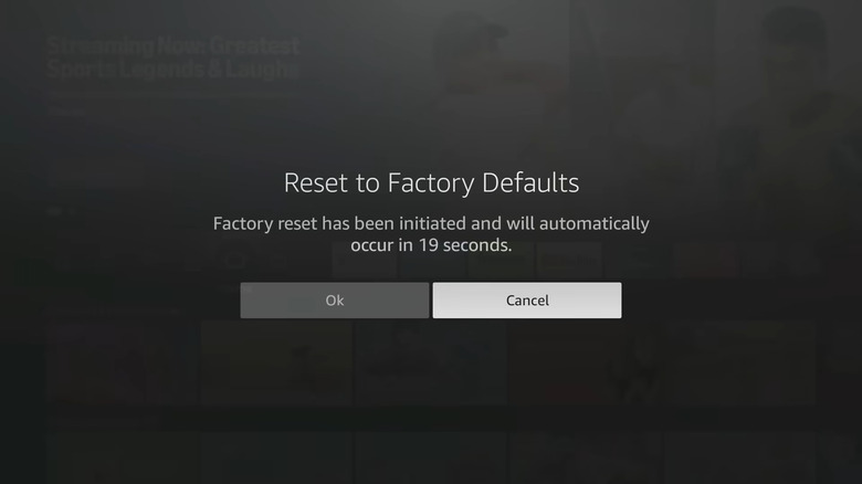 A dark gray screen showing that the Reset To Factory Defaults countdown has started