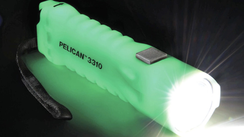 The Pelican 3310 photoluminescent flashlight glowing in the dark