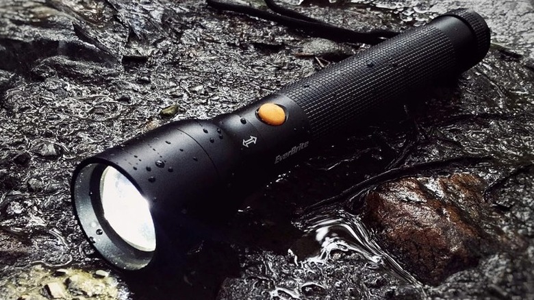 Everbright flashlight on rock