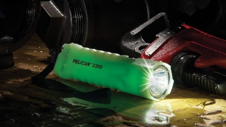 Pelican 3310PL flashlight on wet floor