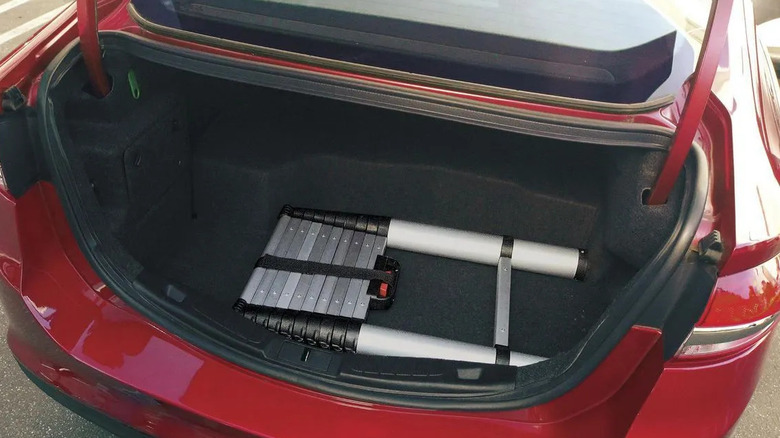 A folded Franklin telescopic ladder in the boot of a car.