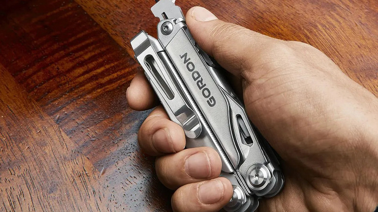 A Gordon folding multi-tool being held.