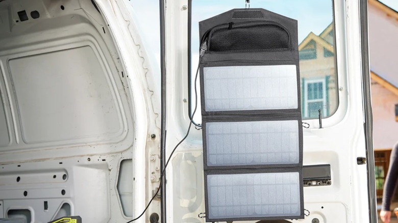 Ryobi solar panel hanging on car