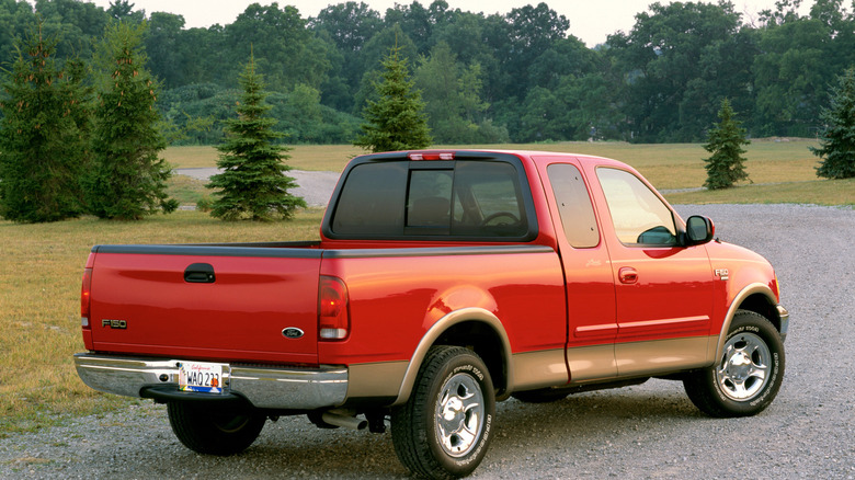 2002 Ford F-150 on country lot, rear-right 3/4 view