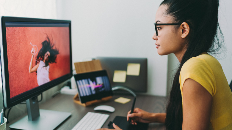 woman editing photo on desktop