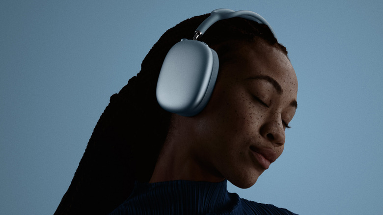 A girl wearing the AirPods Max