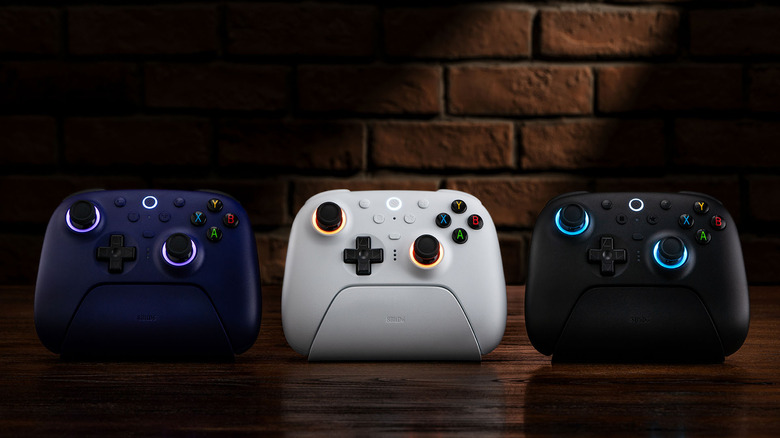 The 8BitDo Ultimate 2 controllers on their charging docks