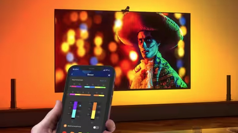 Person using app for backligh kit