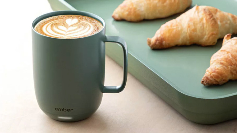 Ember Mug beside tray of pastries