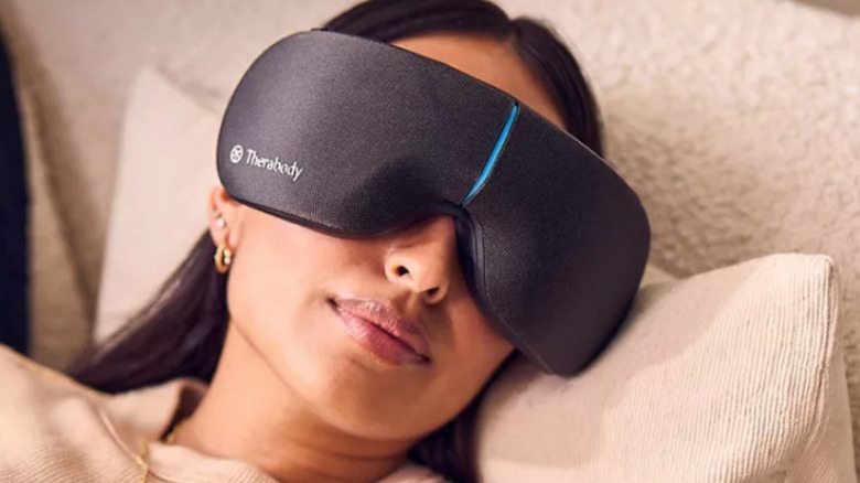 SmartGoggles over woman's eyes while in bed