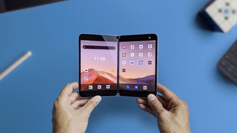 Person unfolding the Microsoft Surface Duo
