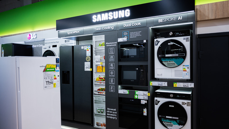 A collection of smart appliances made by Samsung displayed inside a store