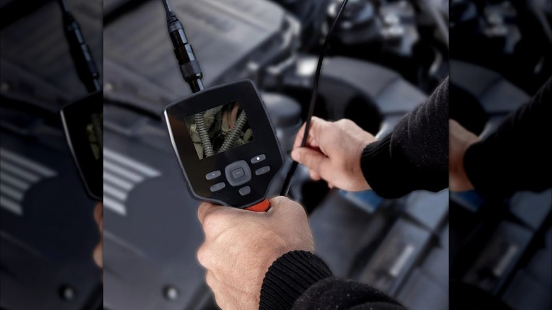 man using digital inspection camera