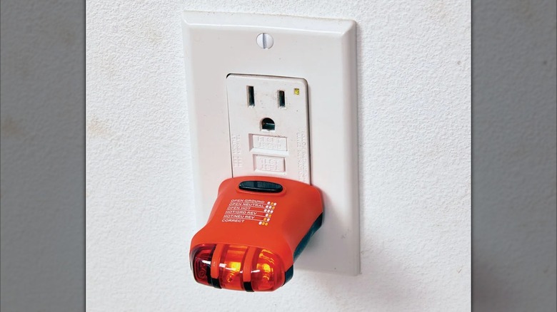 Electrical Receptacle Tester plugged into wall