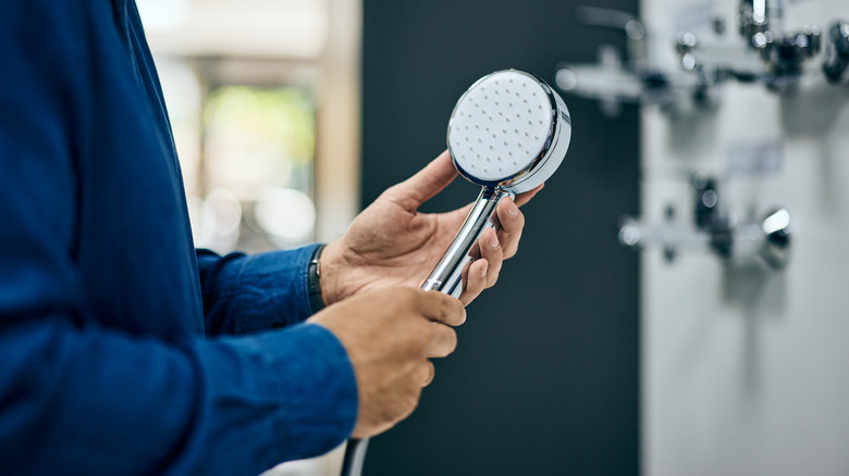 Person holding a shower head