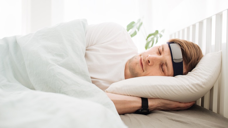 Man sleeping with a headband on