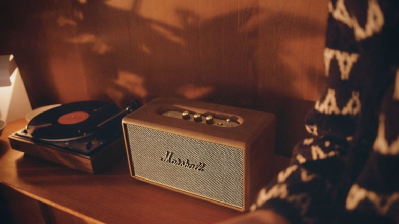 A Marshall speaker on display next to a record player