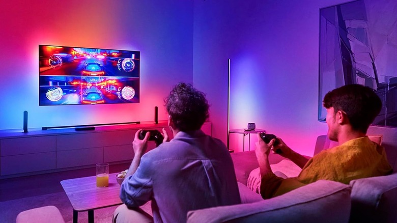 two person playing games on TV