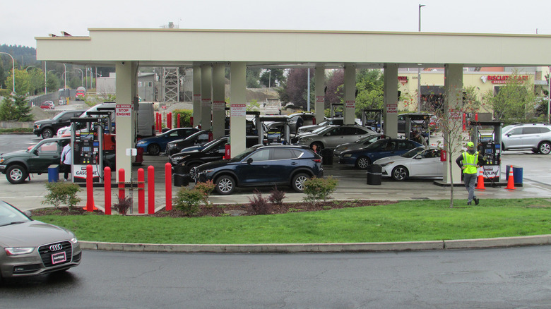 A busy Costco gas station with people waiting to fill up