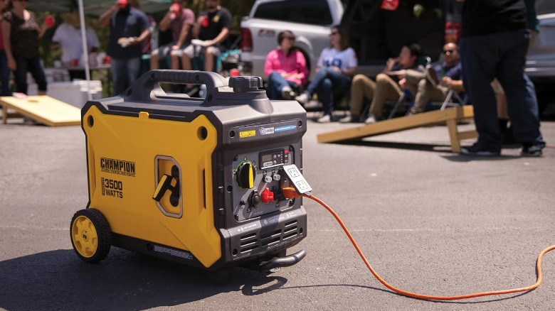 The Champion 100571 generator on the pavement at an event.