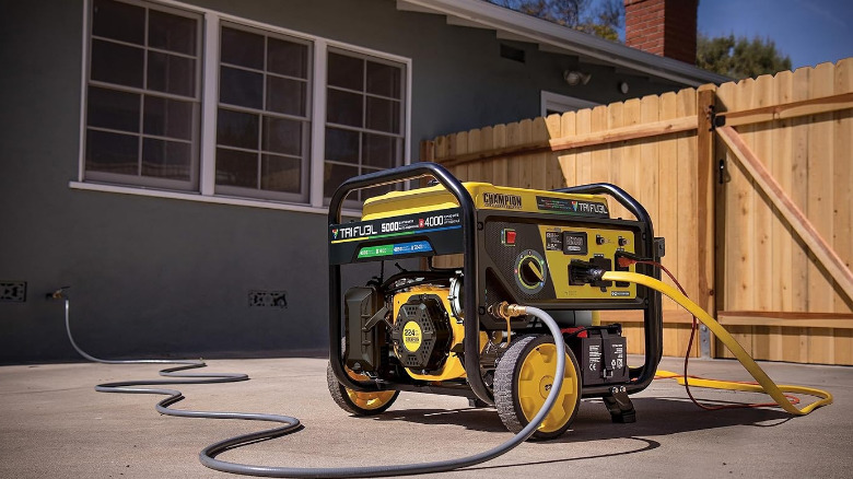 A 5000-Watt Electric Champion generator near the back facade of a house.