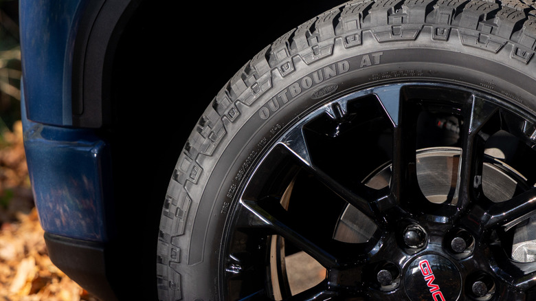 Close-up of a Goodyear Wrangler Outbound AT tire on a GMC