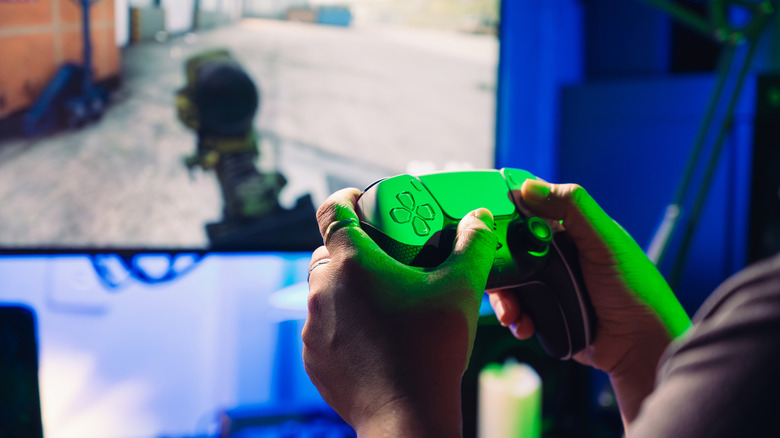 A person playing video games on their PlayStation