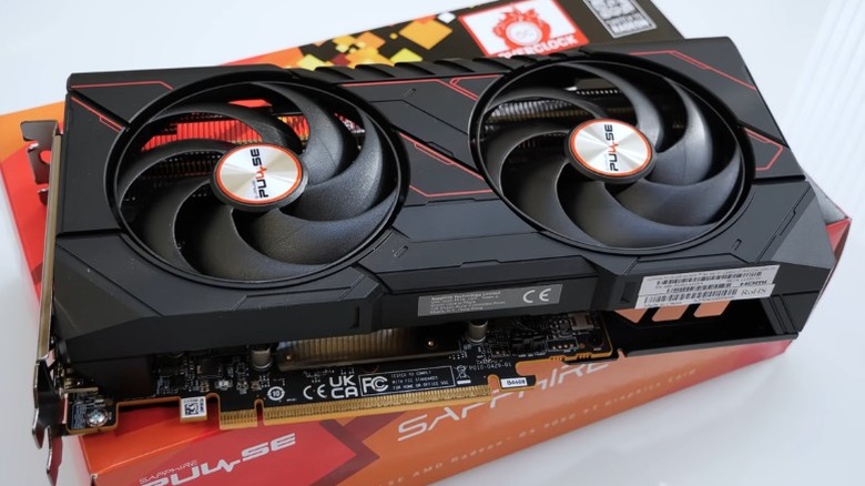 Sapphire Radeon RX 9060 XT 16 GB graphics card placed on its box.