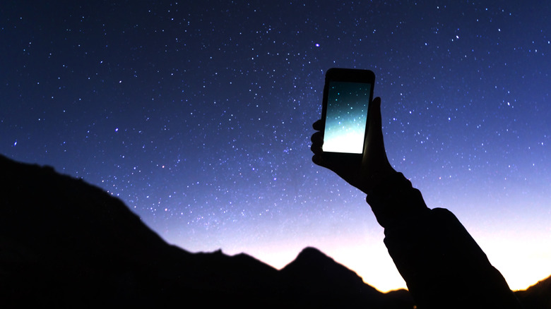 smartphone with night sky backdrop