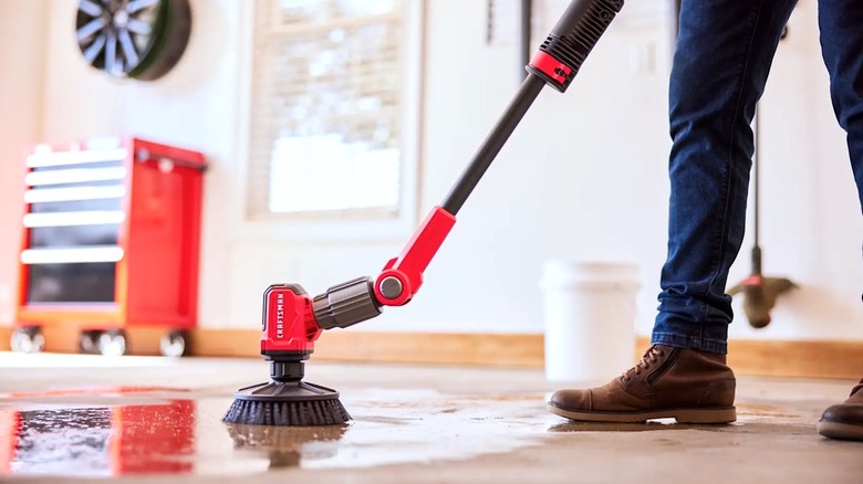 Picture showing person using Craftsman Power Scrubber in their garage